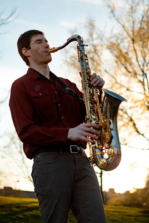 Jon playing saxophone